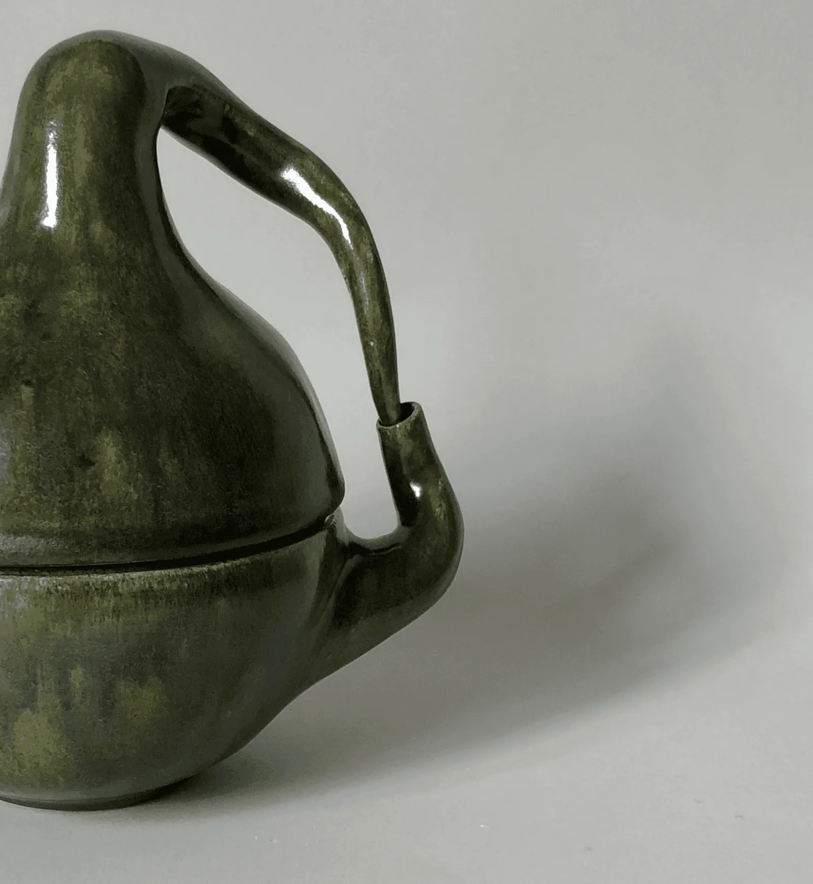 Coffee pot with its long curved handle, assembled