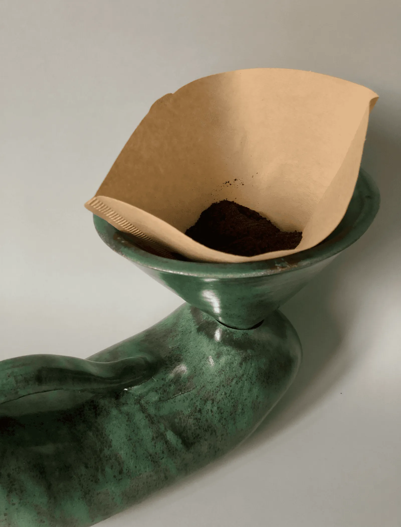Pour-over filter with coffee sitting in the pot